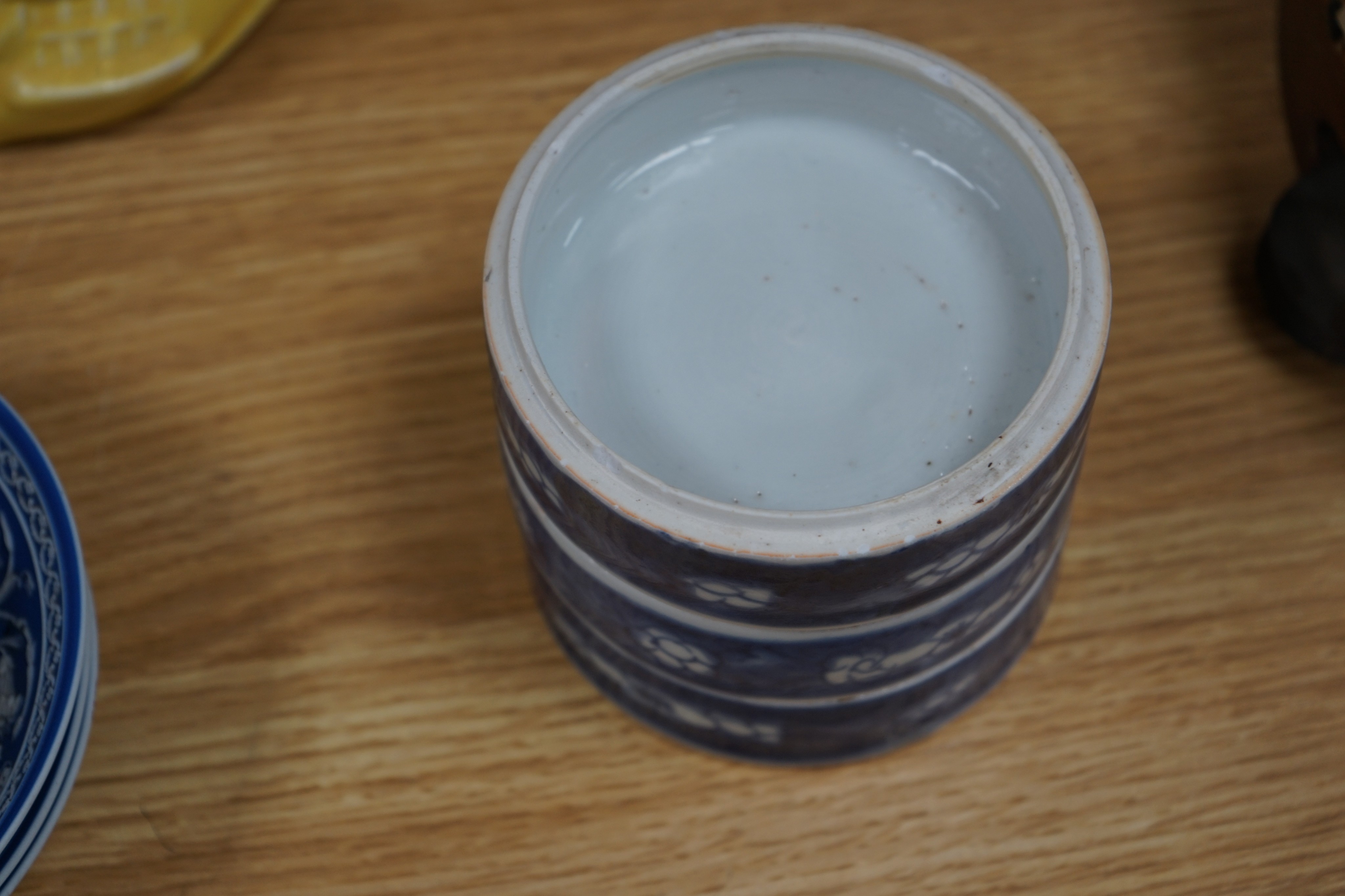 A Chinese blue and white ovoid jar and cover and similar stacking box, Kangxi and a Qing blue and white footed cup, tallest 15cm